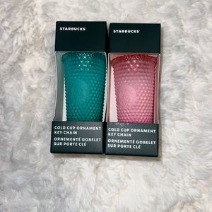 Two Starbucks keychains
